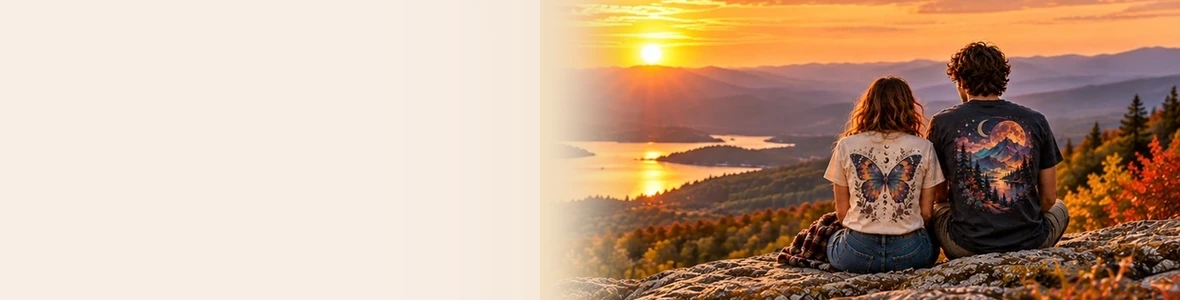 Two friends in graphic tees looking across a golden autumn valley at sunset